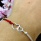 Martisor de argint tip bratara din argint cu snur reglabil, dama/copil, argint/ argint placat cu aur, snur alb rosu, 2 inimi conectate, cadou martie, argintiu/auriu
